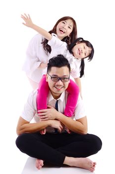 Portrait of a happy asian family in the studio