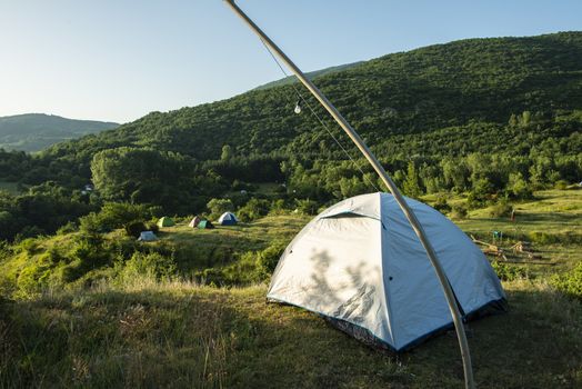 Many tents in the mountain.. Outdoor concept. Sunshine morning in the forest.