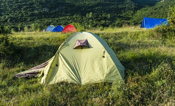 Many tents in the mountain.. Outdoor concept. Sunshine morning in the forest.