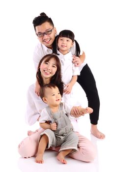 Indoor portrait of a happy asian family