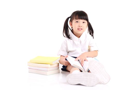 Asian girl sitting on the floor and reading book