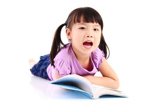 Asian girl lying on the floor and reading