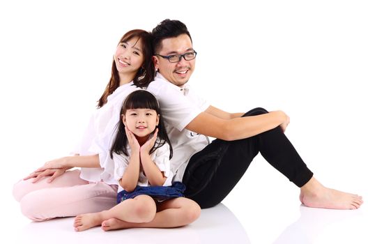 Portrait of a happy asian family in the studio
