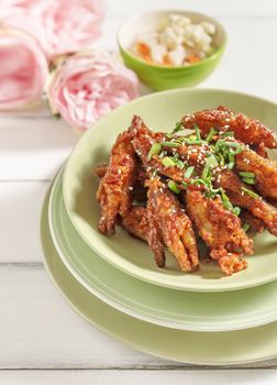 Crispy fried spicy chicken feet served with pickled vegetables