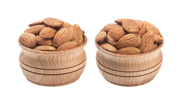 Almond nut in wooden bowl isolated on a white background with clipping path
