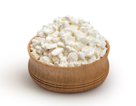 Cottage cheese in wooden bowl isolated on white background with clipping path