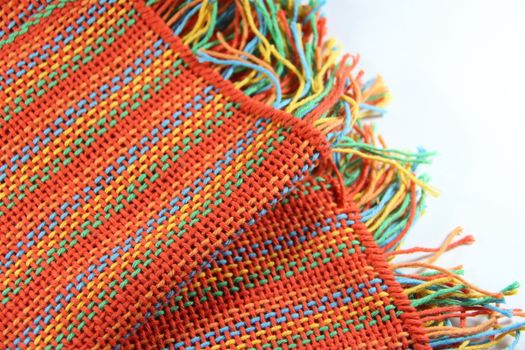 colorful knitted garments and blankets, comb loom