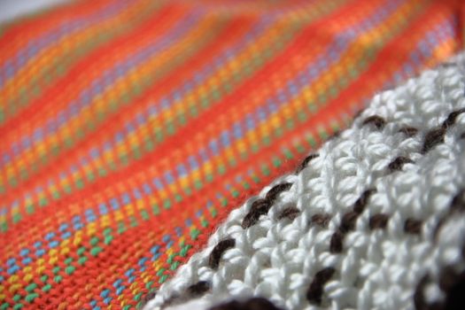 colorful knitted garments and blankets, comb loom