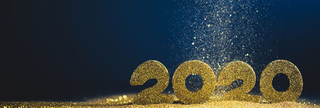 2020 New Year luxury glitter design concept numbers in golden glitters on blue background