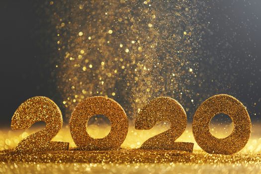 2020 New Year luxury glitter design concept numbers in golden glitters on blue background