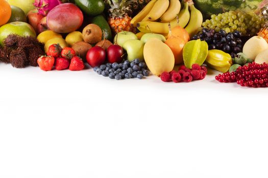Fresh tropical fruits harvest pile isolated on white background with copy space for text