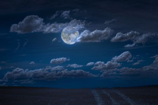 Moon and clouds in the night. Moonlight and road background. Dark blue backdrop.