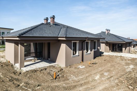 New build houses. Sunny day. Construction site