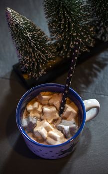 Cup with milk and Marshmallow for christmas. Christmas trees