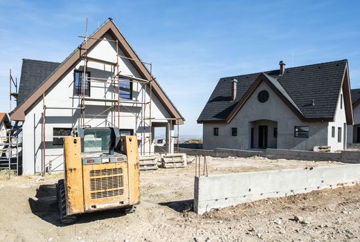 New build houses. Black roof, mountain