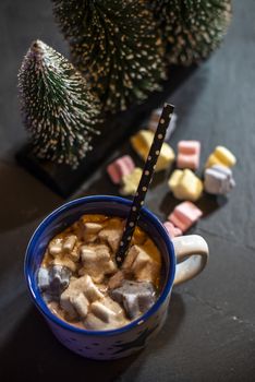 Cup with milk and Marshmallow for christmas. Christmas trees