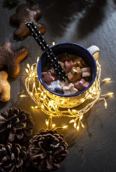 Cup of milk and Marshmallow. Christmas lights and ornaments