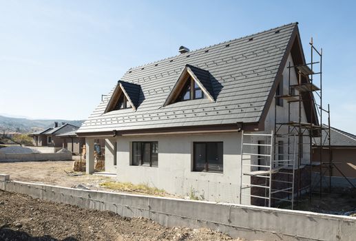 New build houses. Black roof, mountain