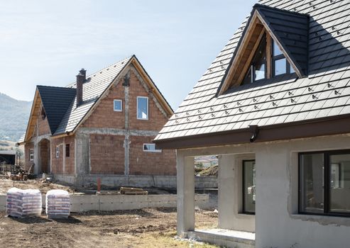 New build houses. Black roof, mountain