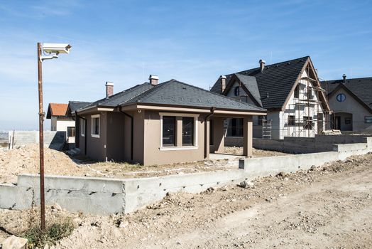 New build houses. Sunny day. Construction site