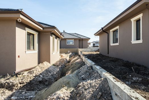 New build houses. Sunny day. Construction site