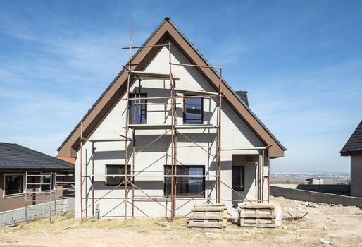 New build houses. Black roof, mountain