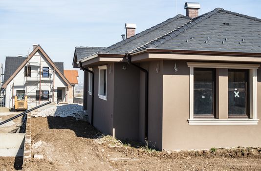 New build houses. Sunny day. Construction site