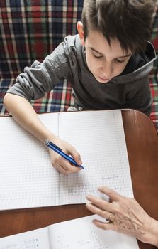 Boy do his homework. Notebook