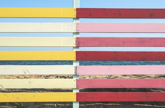 Red and yellow planks background. Sunny day