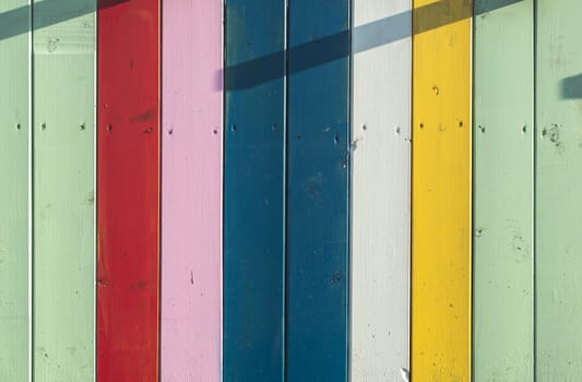 Colorful planks background. Sunny day