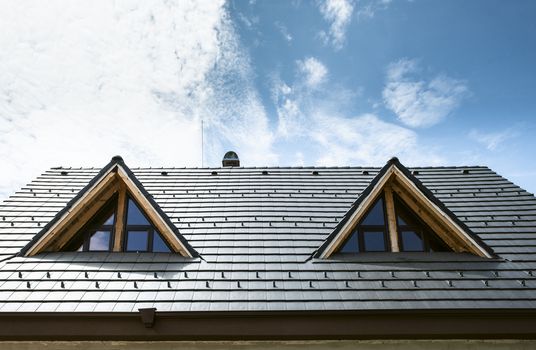 Laying roof tiles on new build house