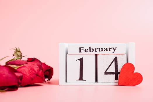 Red wood Hearts and gift box on pink background, 14 February, valentine day concept