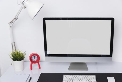 Computer Monitor on desk interior at home office blank screen