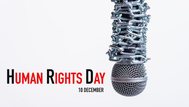 Chain on microphone with HUMAN RIGHTS DAY 10 december text on white background, Human rights day concept