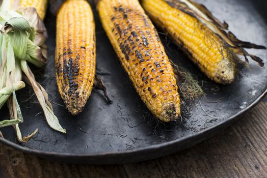 Roasted corn on the grill. Close up