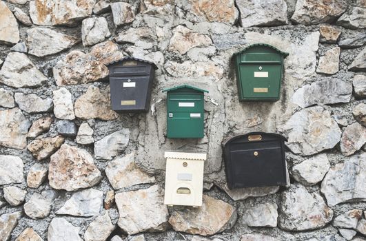 Various mailboxes. Different colors and shapes