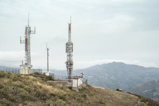 Telecommunication (GSM) towers with TV antennas on the mountain