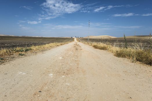 Vintage dirt road and blue sky