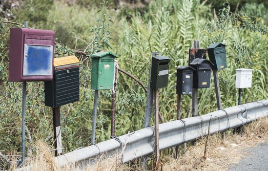 Various mailboxes. Different colors and shapes