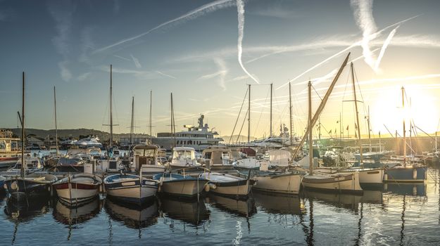 Yachts in Saint-Tropez bay at sunset.