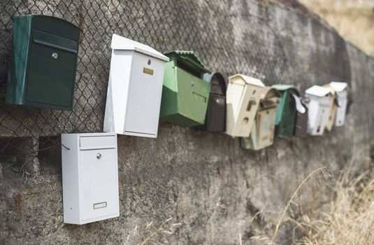 Various mailboxes. Different colors and shapes