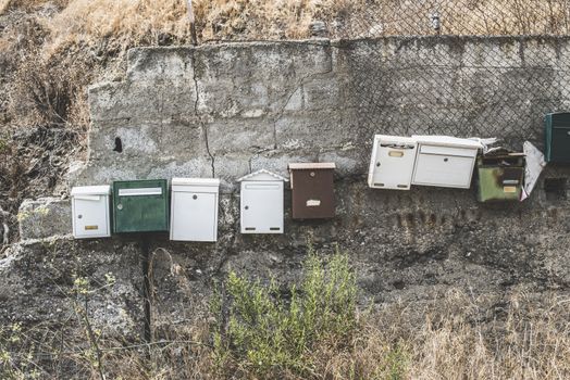 Various mailboxes. Different colors and shapes