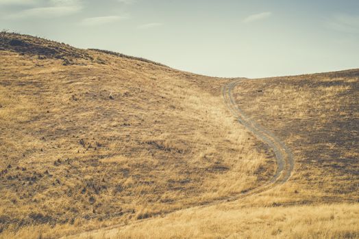 Vintage dirt road and blue sky