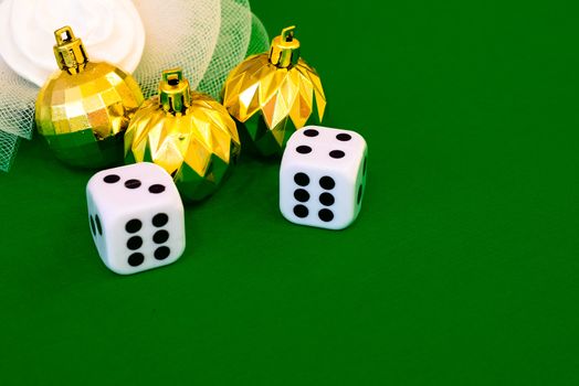 white dice on green cloth or tablecloth