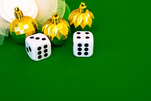 white dice on green cloth or tablecloth