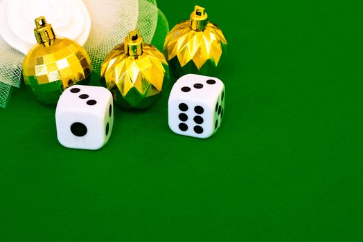 white dice on green cloth or tablecloth