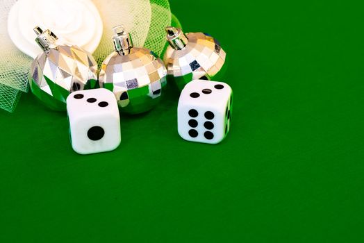 white dice on green cloth or tablecloth