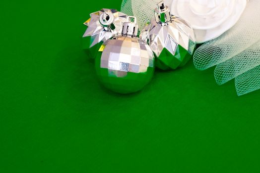 Christmas decoration silver or gold on green tablecloth or cloth