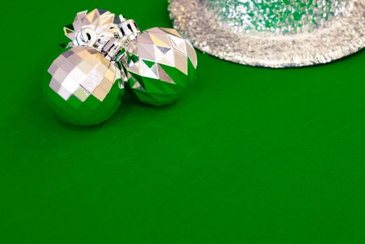 Christmas decoration silver or gold on green tablecloth or cloth