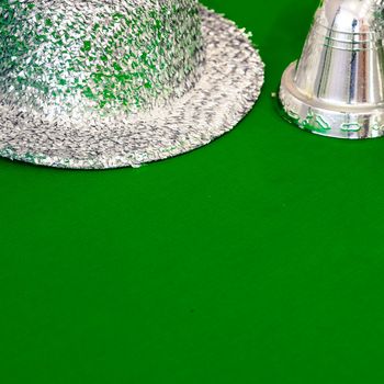 Christmas decoration silver or gold on green tablecloth or cloth